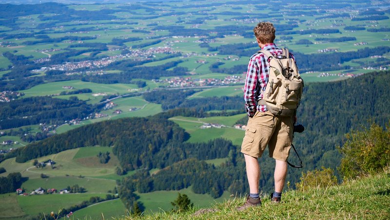 Views of the valley just outside Salzburg, Austria with Nomadic Samuel taking it all in from a high vantage point 