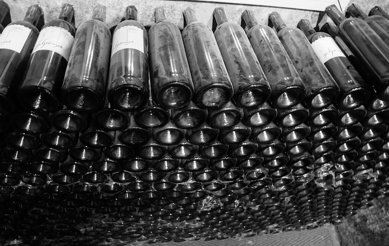 Vintage wine bottles stacked on top of each other in Stellenbosch, South Africa 