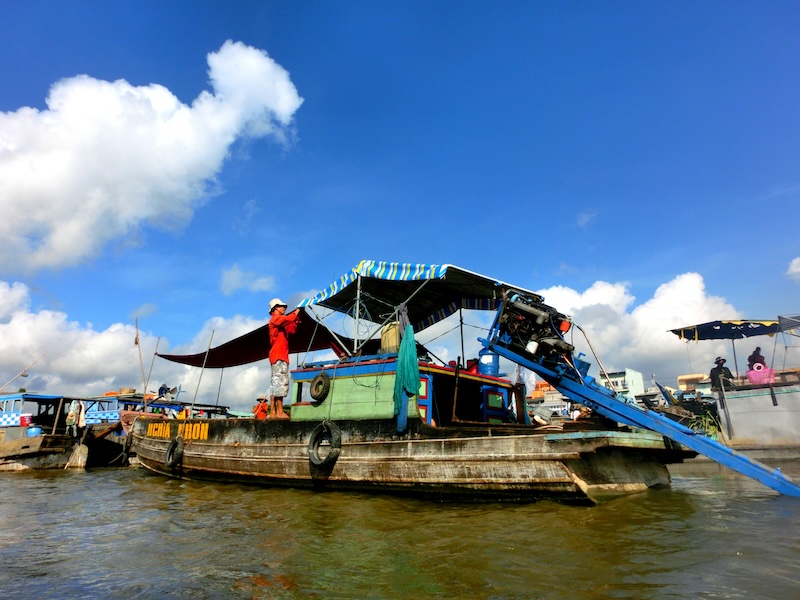 Visit Vietnam for the floating market in the Mekong Delta, Vietnam where trade and commerce and a traditional part of these waterways 