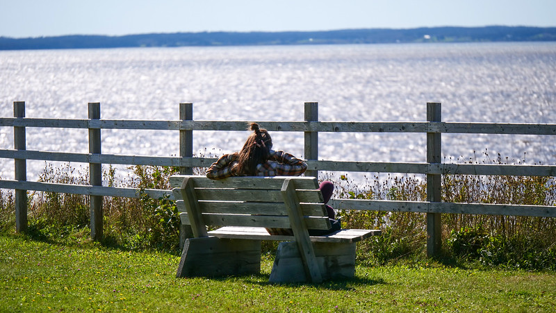 Visiting Battery Provincial Park in St. Peters, Cape Breton Island with beautiful and peaceful views from the park bench
