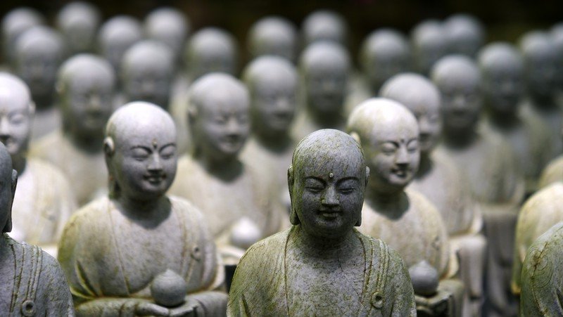 Visiting Hasedera Temple on our day trip to Kamakura from Tokyo with many Buddha sculptures select bokeh Visiting Hasedera Temple on our day trip to Kamakura from Tokyo with many Buddha sculptures select bokeh