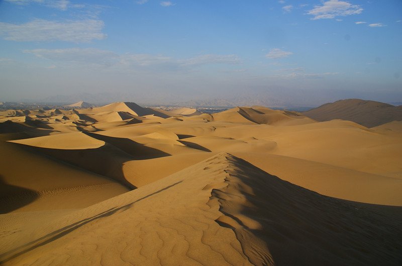 Visiting Huacachina, Peru to see its massive sand dunes that look like they are from another planet!
