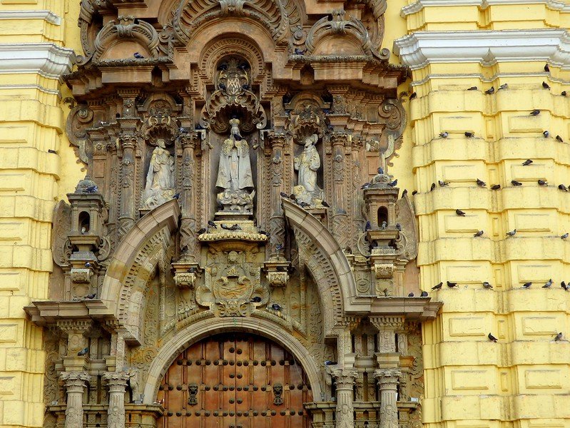 Visiting Lima and exploring the city's historic centre including yellow historic buildings with lots of history in Peru 