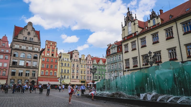 Visiting Market Square in Wroclaw with colorful buildings and art installations in Poland Visiting Market Square in Wroclaw with colorful buildings and art installations in Poland