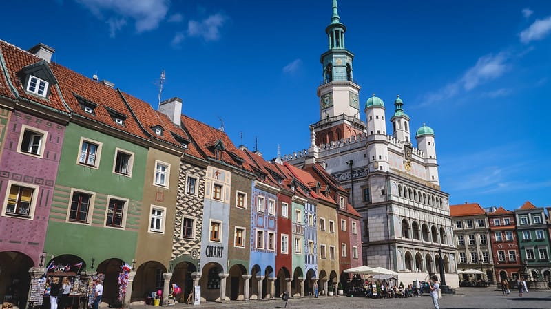 Visiting Poznan's Old Market Square with a range of colorful buildings in Poland Visiting Poznan's Old Market Square with a range of colorful buildings in Poland