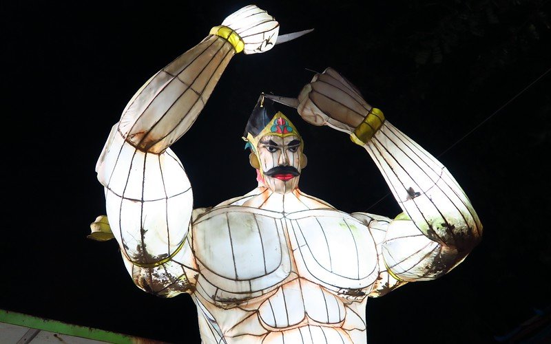 Visiting Sriwedari Park in Solo, Indonesia with lantern warriors on display all lit up at night