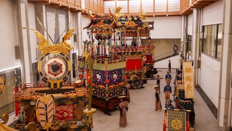 Visiting Takayama Festive Floats Exhibition with an ornate display from a high vantage point in Japan 