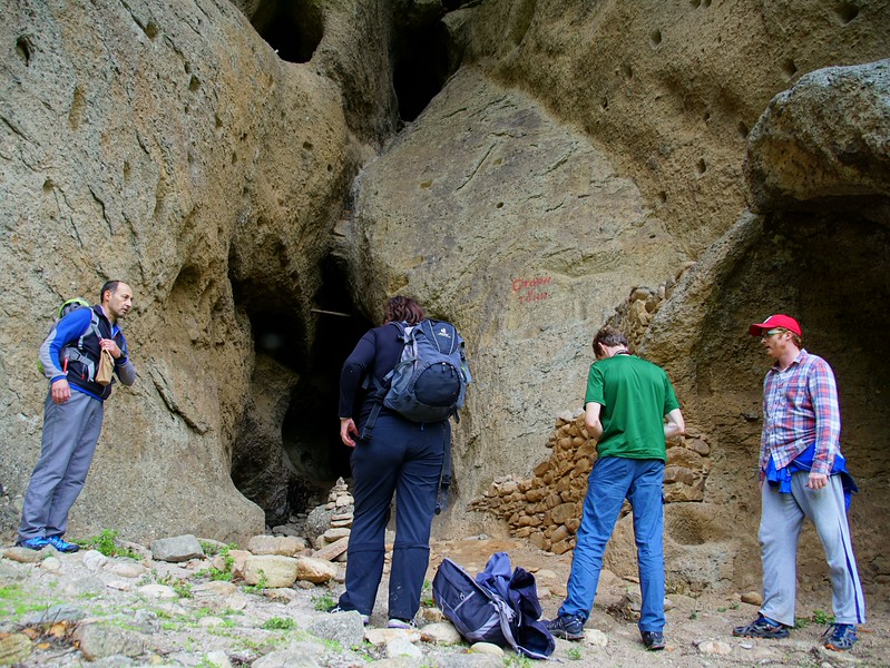 Visiting the cave jail in Meteora as part of a hiking tour with a group of four including Nomadic Samuel admiring it up close and personal 