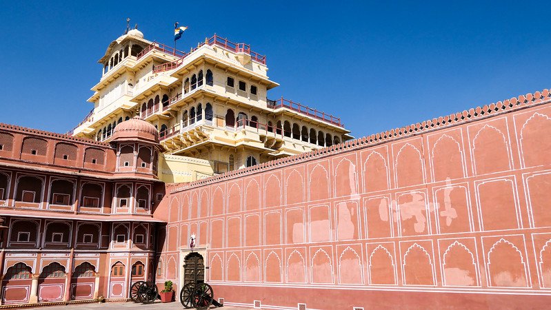 Visiting the City Palace in Jaipur with its distinct pink appearance and imposing walls and facade in Rajasthan, India