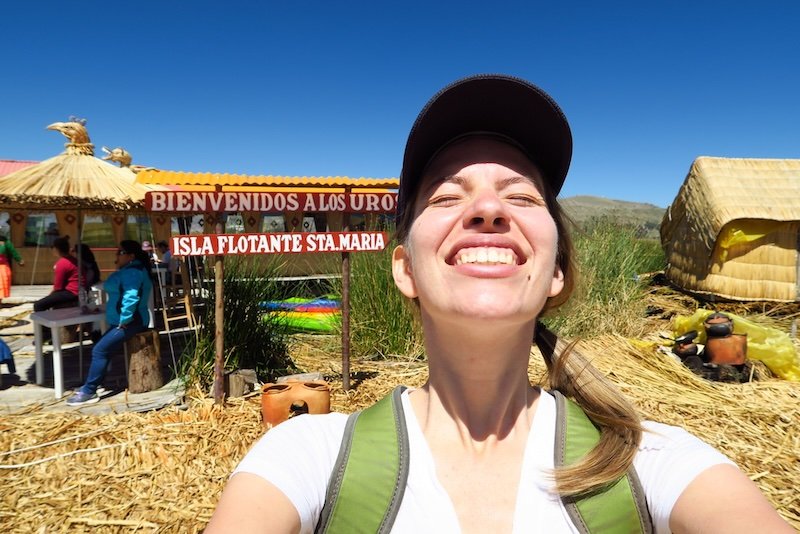 Visiting the floating islands is That Backpacker Audrey Bergner with a huge smile selfie on her Lake Titicaca trip 