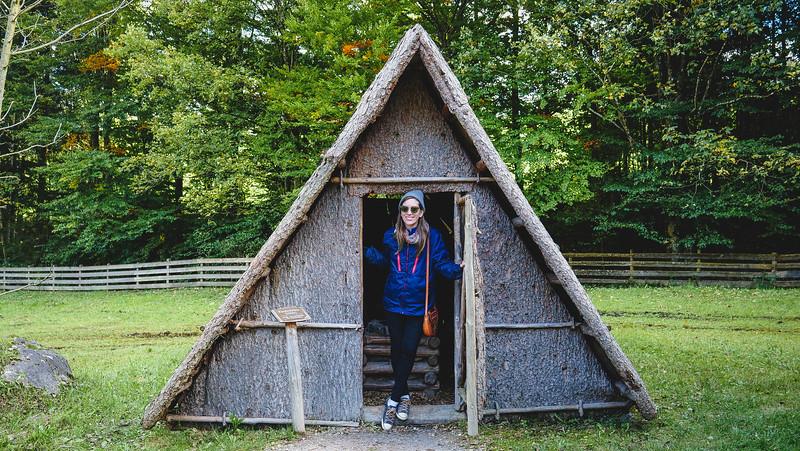 Visiting the Museum of Tyrolean Farmhouses with That Backpacker Audrey Bergner outside the door of a distinct Austrian A-frame