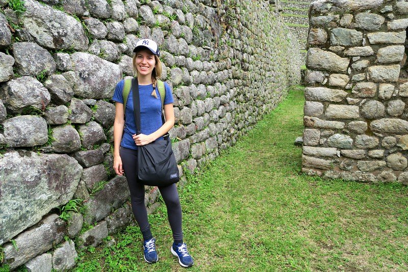 Visiting the ruins of Wiñay Wayna on the Inca Trail with That Backpacker Audrey Bergner surveying the intricate details up close and personal 