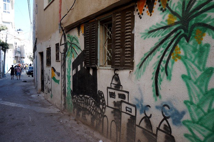 Visiting the West Bank / Palestine on an eye opening tour with graffiti a common scene 