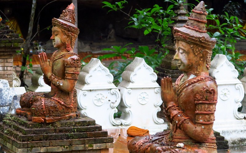 Visiting Wat Palad in Chiang Mai with details of the intricate statues of the temple in Thailand