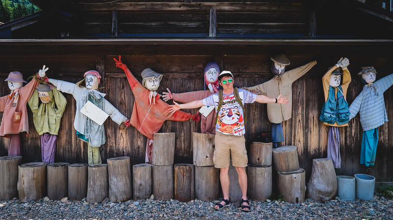 Walking down the streets of town in Shirakawa-go with Nomadic Samuel posing by the traditional farming scarecrows in Japan Walking down the streets of town in Shirakawa-go with Nomadic Samuel posing by the traditional farming scarecrows in Japan