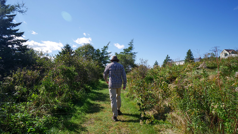 Walking the St. Peters Coastal Trail in the village of St. Peters in Southern Cape Breton is Nomadic Samuel enjoying nature