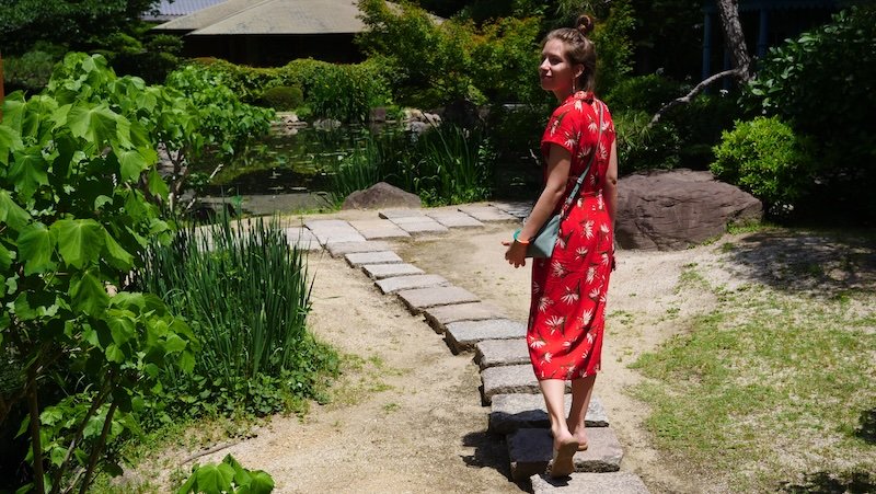 Walking tour in Osaka, Japan as enjoyed by That Backpacker Audrey Bergner visiting beautiful places in the city in a dress 