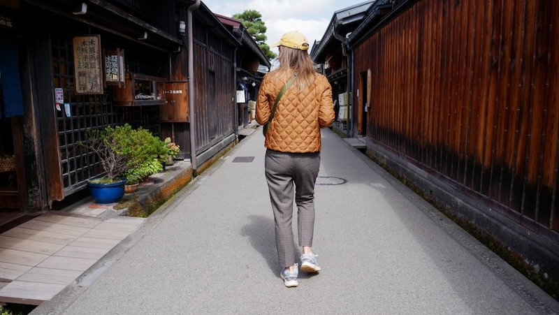 Wandering down traditional streets in Takayama, Japan is That Backpacker Audrey Bergner 
