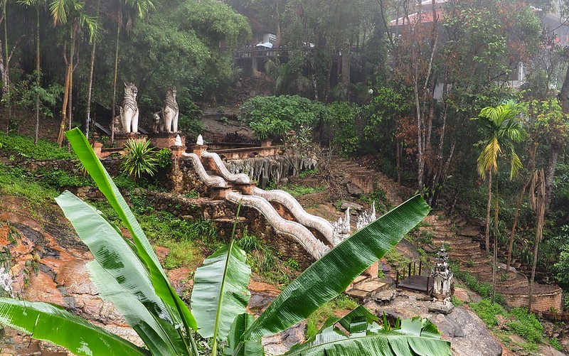 Wat Palad a temple hidden in the jungle in Chiang Mai views of the staircase entrance leading downward 