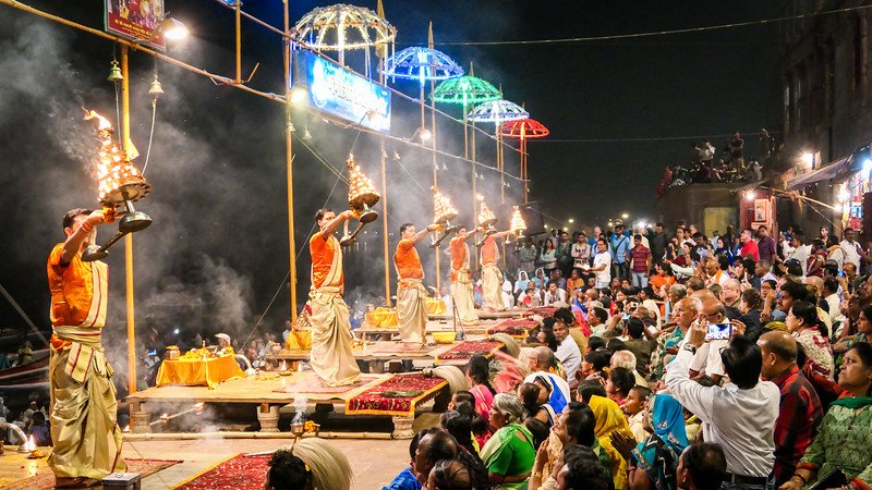 Watching the Fire Worship ceremony in Varanasi along the Ganges River with the live performance mesmerizing the crowd