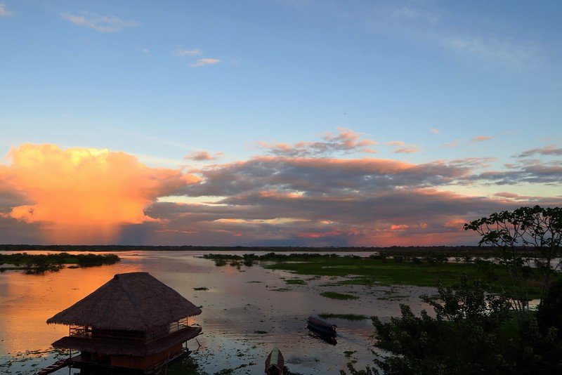 Watching the sunset along the boardwalk in Iquitos, Peru where life moves at a different rhythm and beat