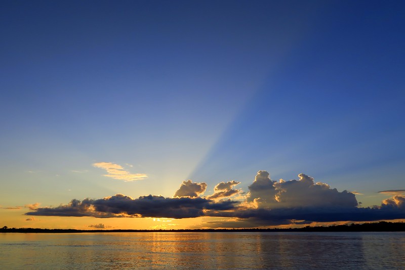Watching the sunset on the Amazon River is one of the most magical experiences I have ever had in my life with majestic waters and clouds and colors