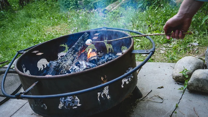 We enjoyed roasting marshmallows on a stick around the fire in summer during our tiny house stay in Toronto We enjoyed roasting marshmallows on a stick around the fire in summer during our tiny house stay in Toronto