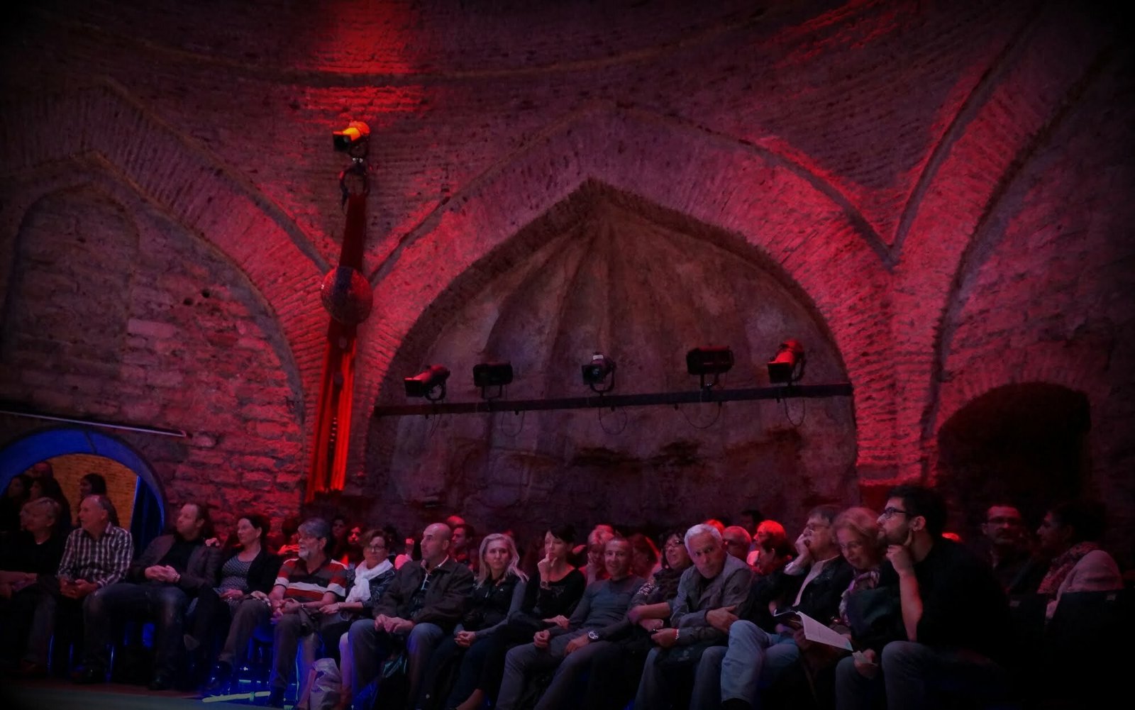 Whirling dervish performance in Istanbul, Turkey audience mesmerized by the performance and in total awe 