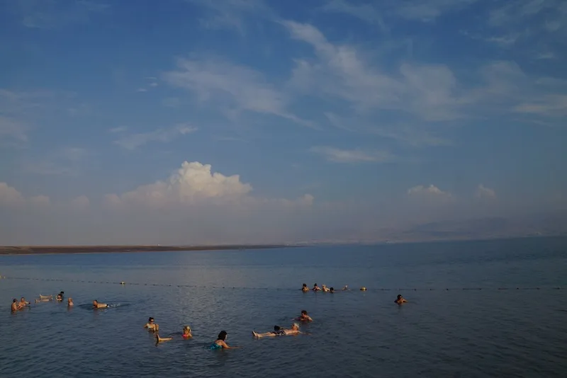 Wide angle view of the Dead Sea showcasing the vastness of the sea and clouds in Israel 