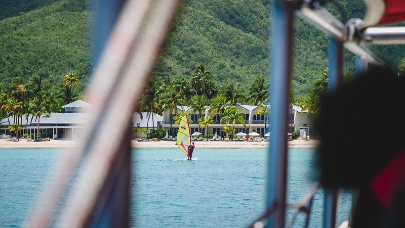 Windsurfer in Carlisle Bay enjoy adventure sports tourism in Antigua Windsurfer in Carlisle Bay enjoy adventure sports tourism in Antigua