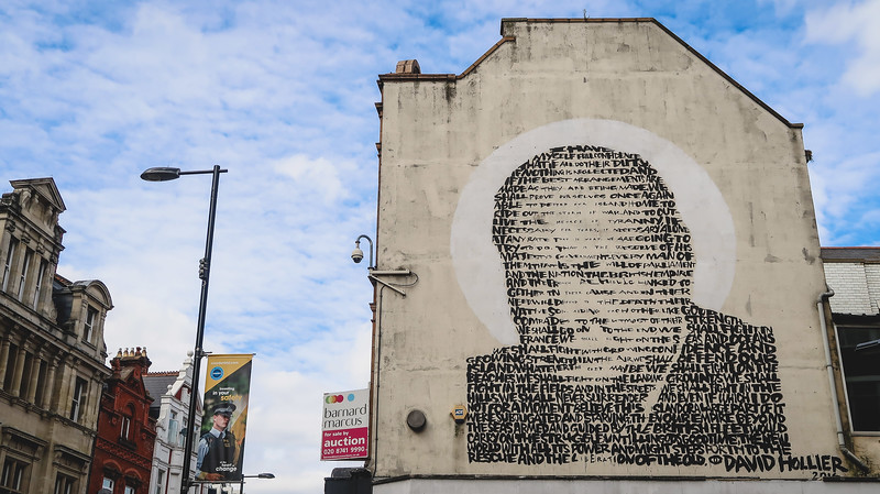 Winston Churchill mural in East Croydon creatively composed with text taking up an entire facade of a building in London, England 