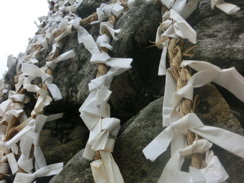 Wishes on paper attached to a giant boulder at the Korean Folk Village is both artistic and fascinating for visitors